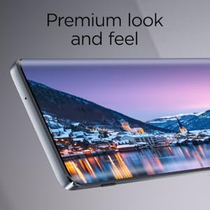 front of smartphone with image of a town on screen